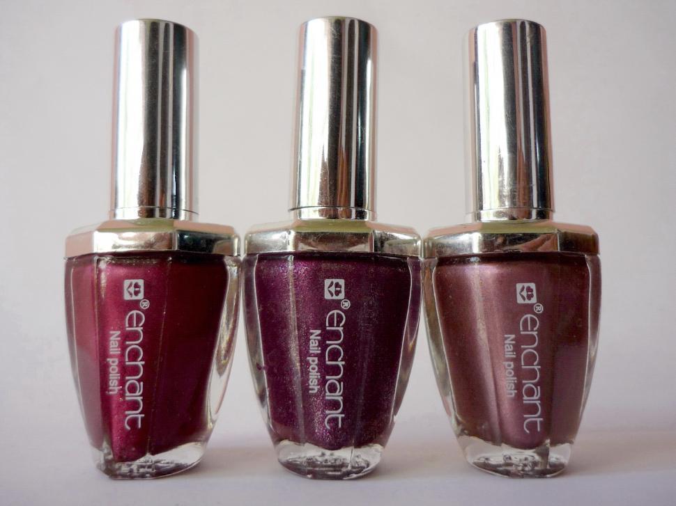 Free Image of Three Bottles of Nail Polish Arranged Neatly 