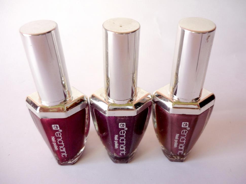 Free Image of Three Bottles of Red Nail Polish 