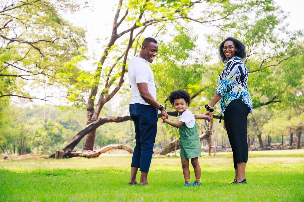 Download Free Stock Photo of Happy parents and young boy in the park 