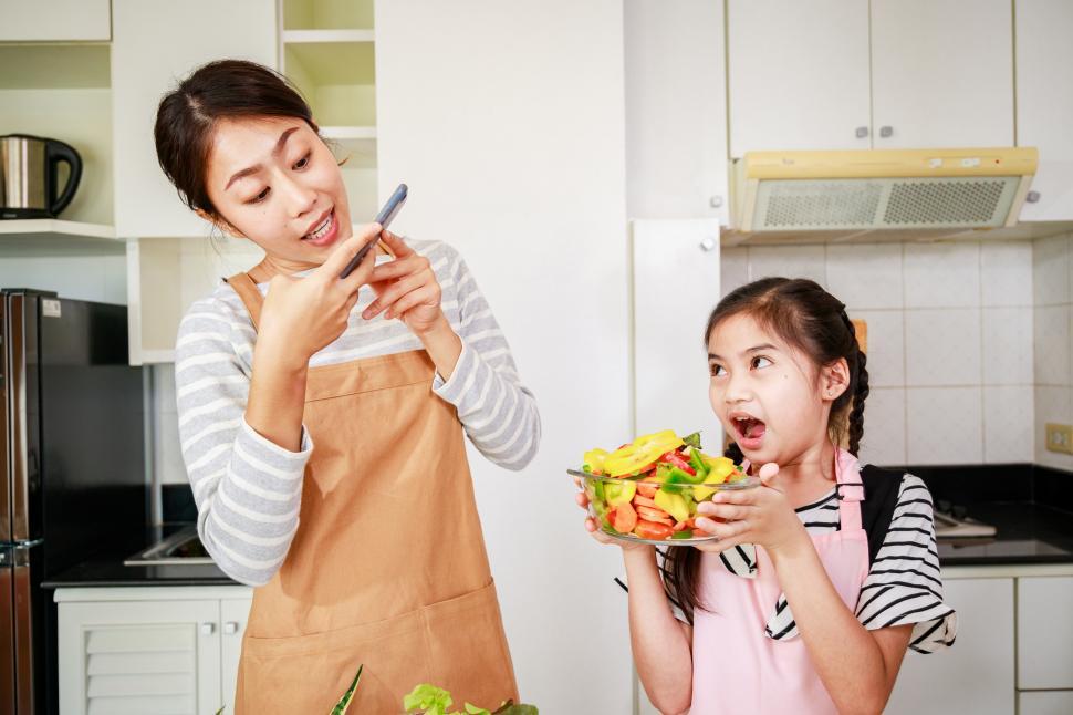 Free Image of Leisure activity in a kitchen at home. Mom and little girl 