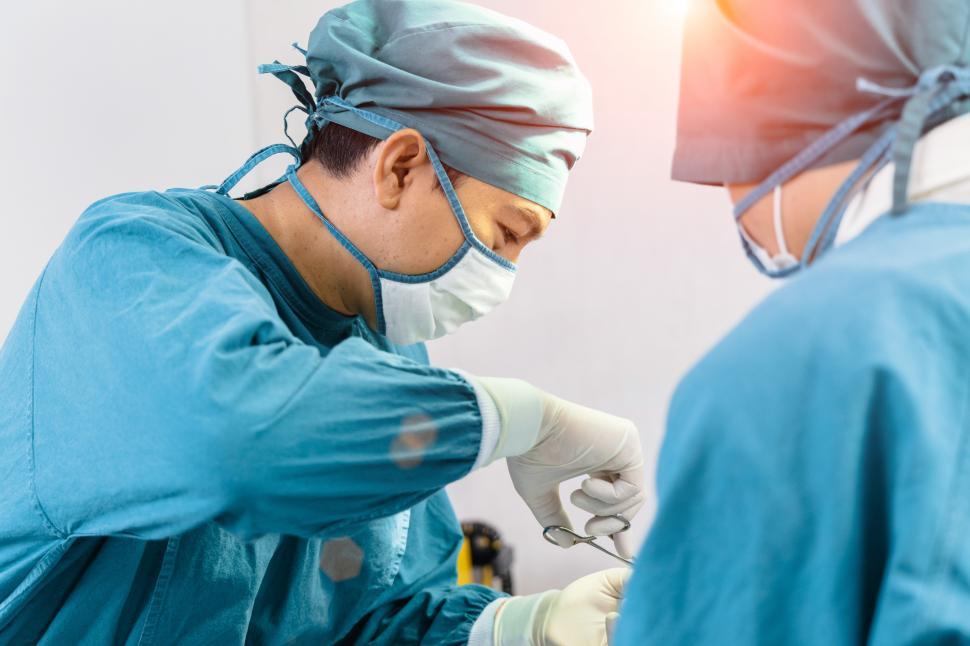 Free Image of Surgeon operating on a patient 