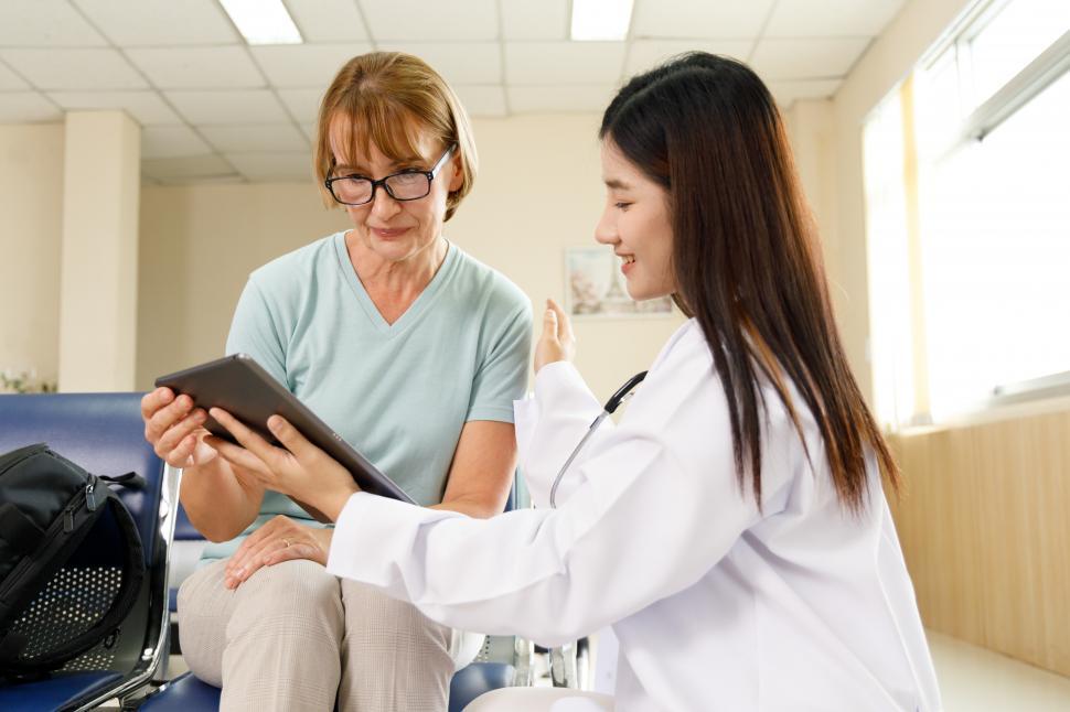 Free Image of Provider explains to older patient 
