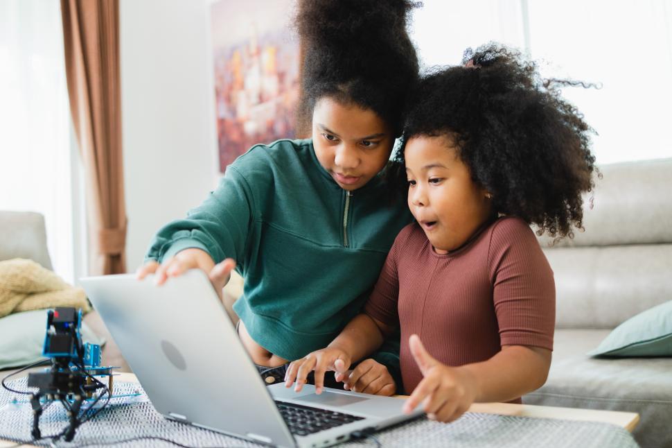 Free Image of Girls excited about computerized robotics kit 