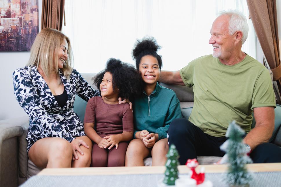 Download Free Stock Photo of Family laughing together in the living room 