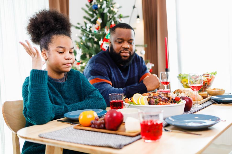Free Image of Family Christmas dinner with teenager and dad 
