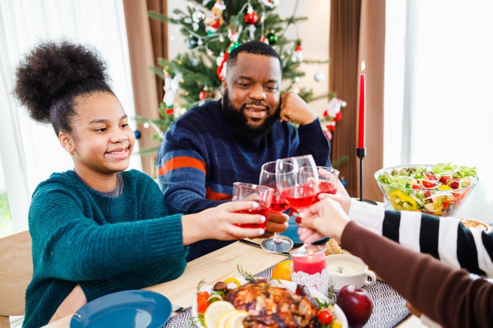 Free Image of Holiday toast at family dinner 