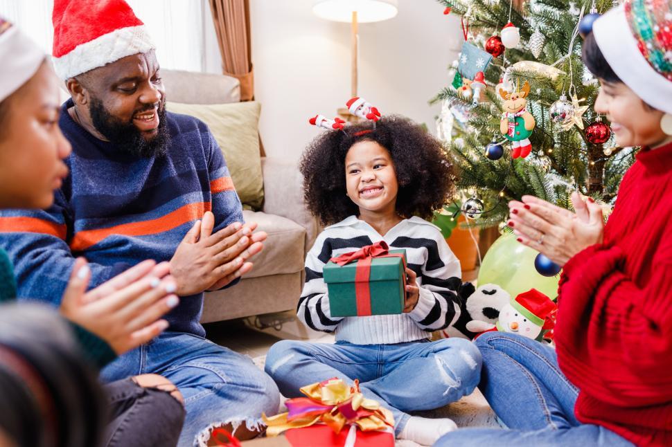 Free Image of Family opening presents at Christmas 