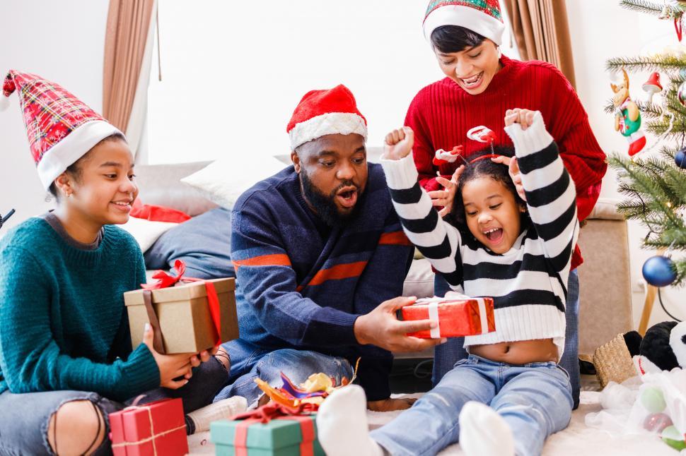 Free Image of Family celebrating with a gifts on Christmas day. 