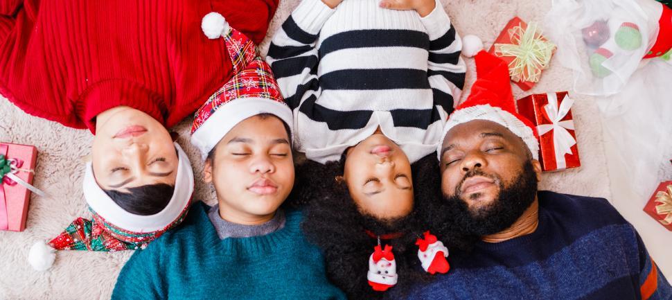 Download Free Stock Photo of Christmas family asleep for the night 