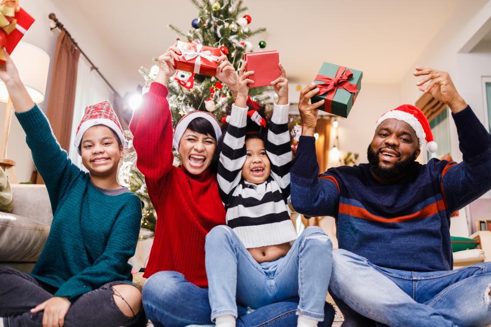 Free Image of Cheerful family celebration of Christmas gifts 