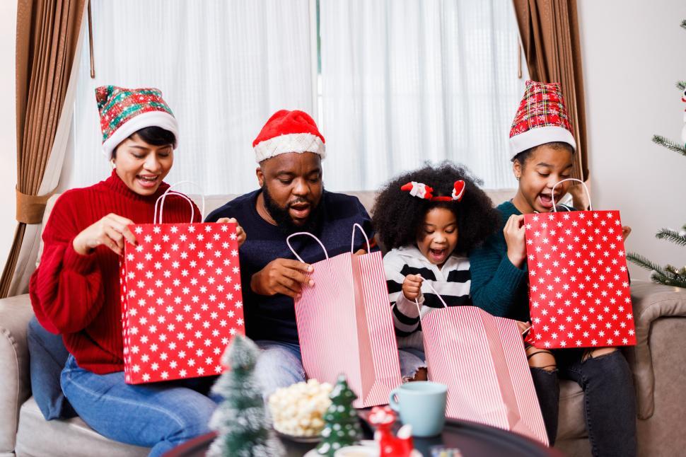 Free Image of Family opening gift bags 