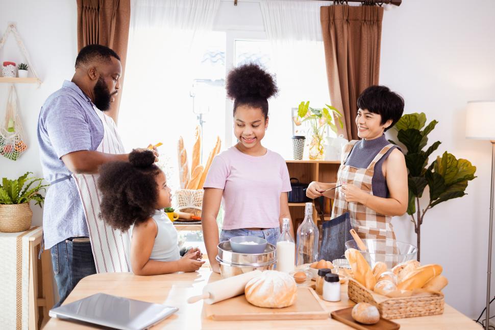 Free Image of Family baking bread 