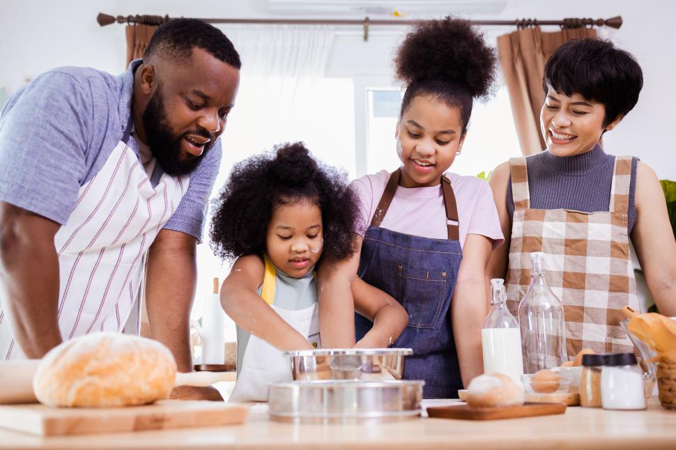 Free Image of Family with two kids baking together 