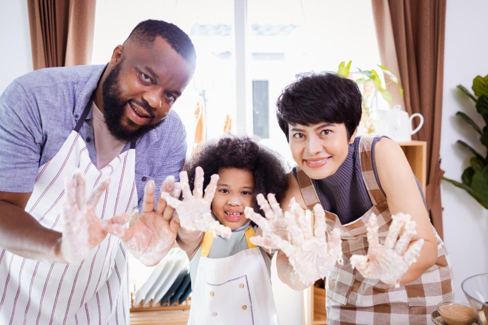 Free Image of Family with hands covered in dough 