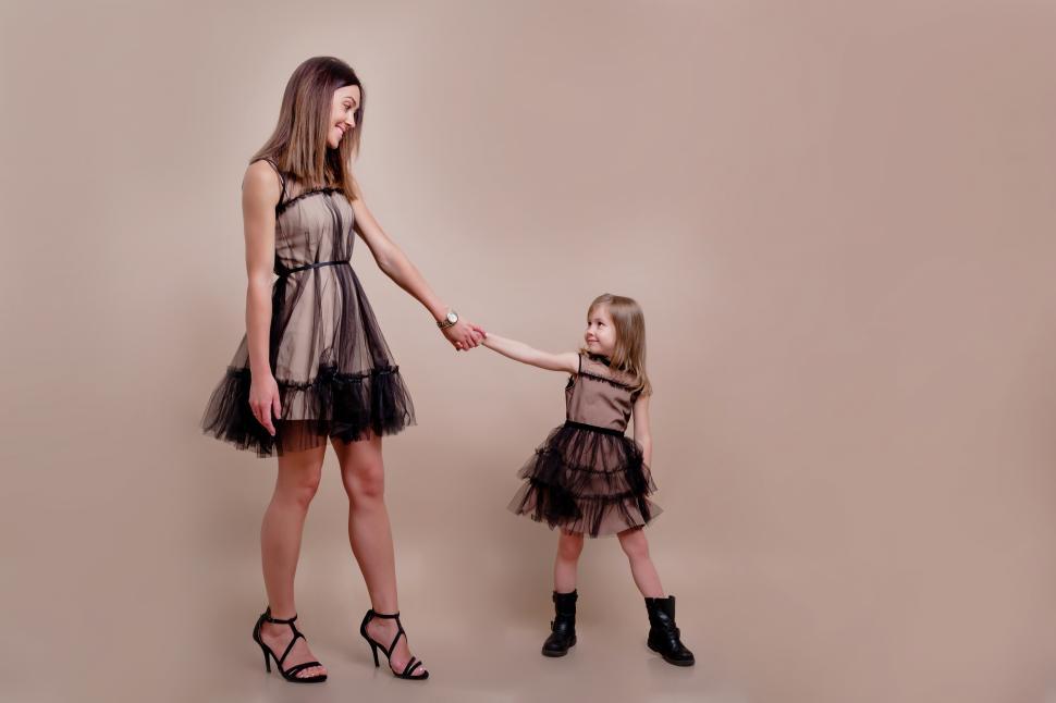 Free Image of Full length photo of mother with daughter on isolated background 
