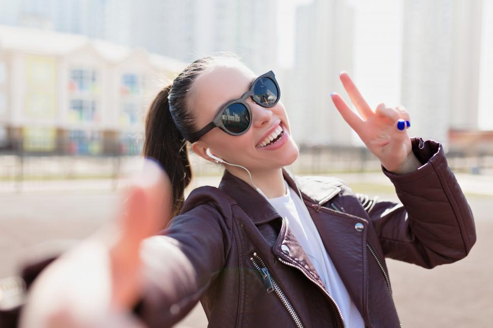 Free Image of Happy adorable woman with smile in black sunglasses m 
