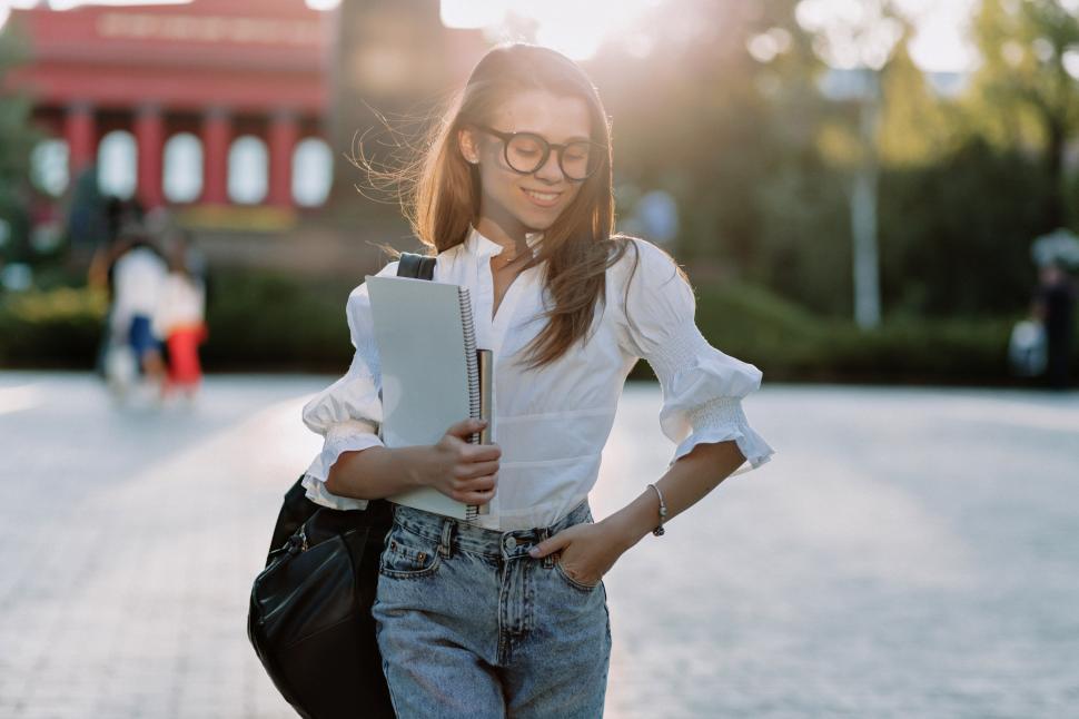 Free Image of Smiling young woman with her digital tablet in the city 