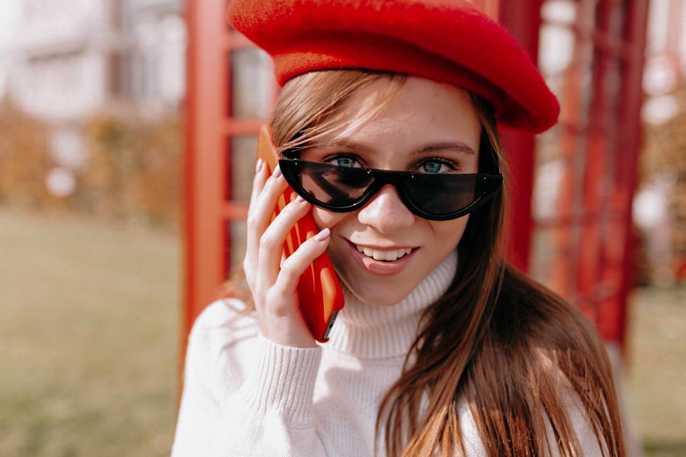 Free Image of Close up outside portrait of stylish modern woman on the phone 