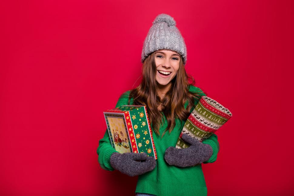 Free Image of Holiday portrait of happy woman wearing winter outfit 