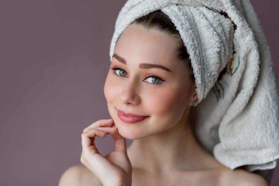 Download Free Stock Photo of Young woman wearing bathrobe and towel over her head 
