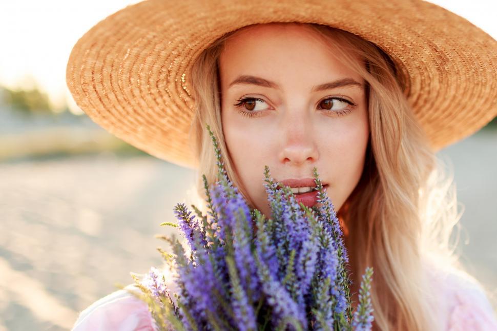 Free Image of Woman collecting lavender near the beach 