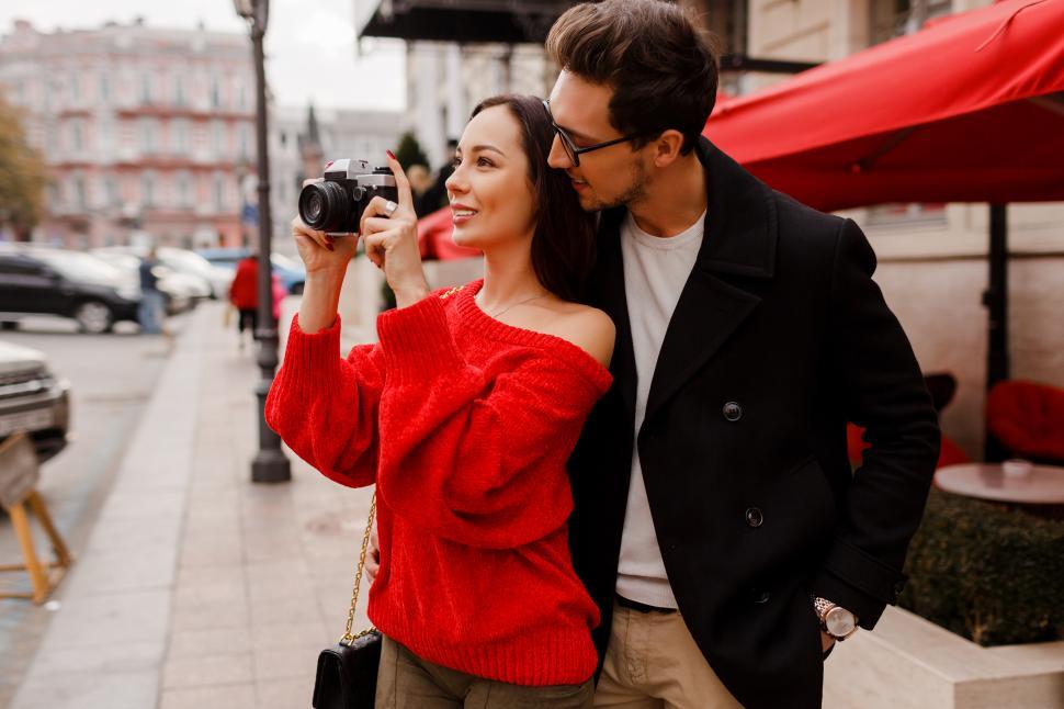 Free Image of Fashionable elegant couple in love walking on the street 