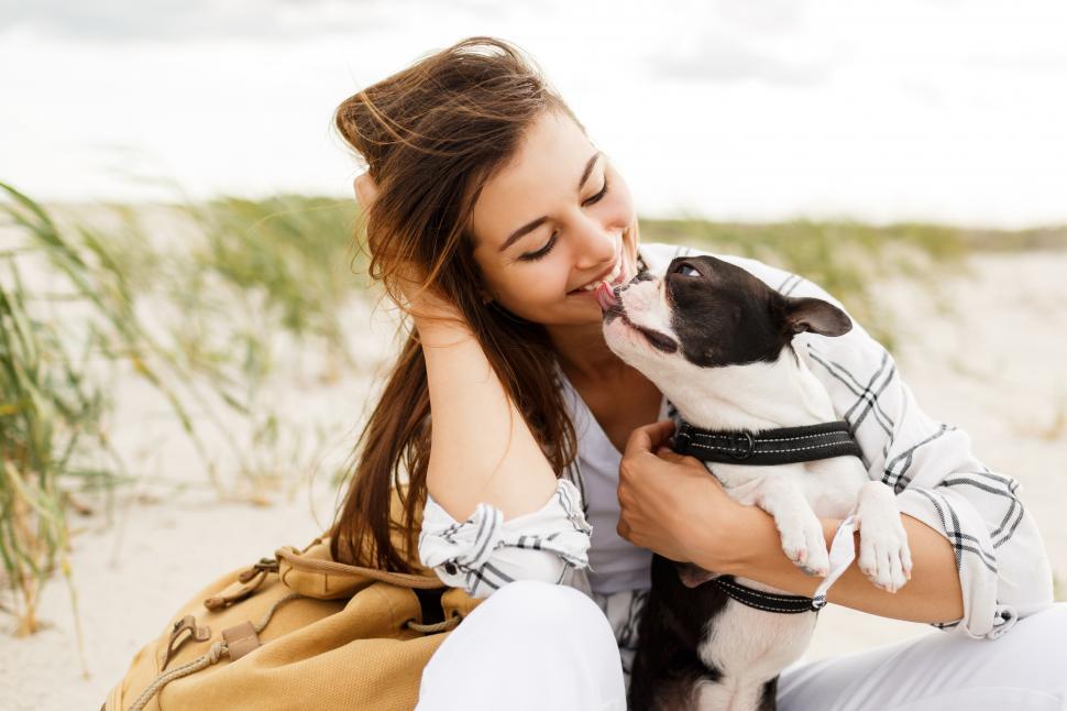 Free Image of Cheerful woman with cute boston terrier dog 