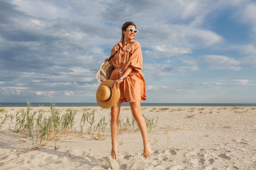 Free Image of Fashionable summer image of beautiful  brunette female in trendy linen dress 