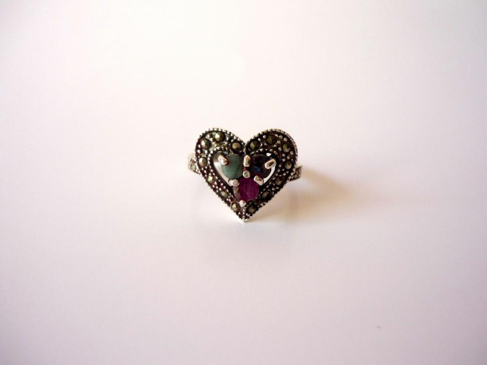Free Image of Black and White Heart Shaped Ring on White Surface 
