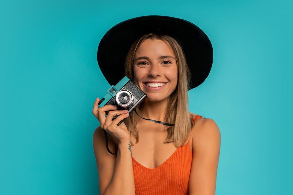 Free Image of Woman holding vintage camera 