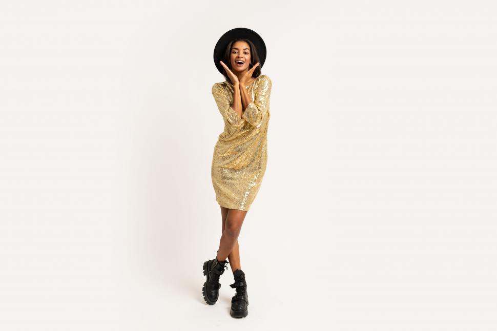 Free Image of Woman in golden party dress 
