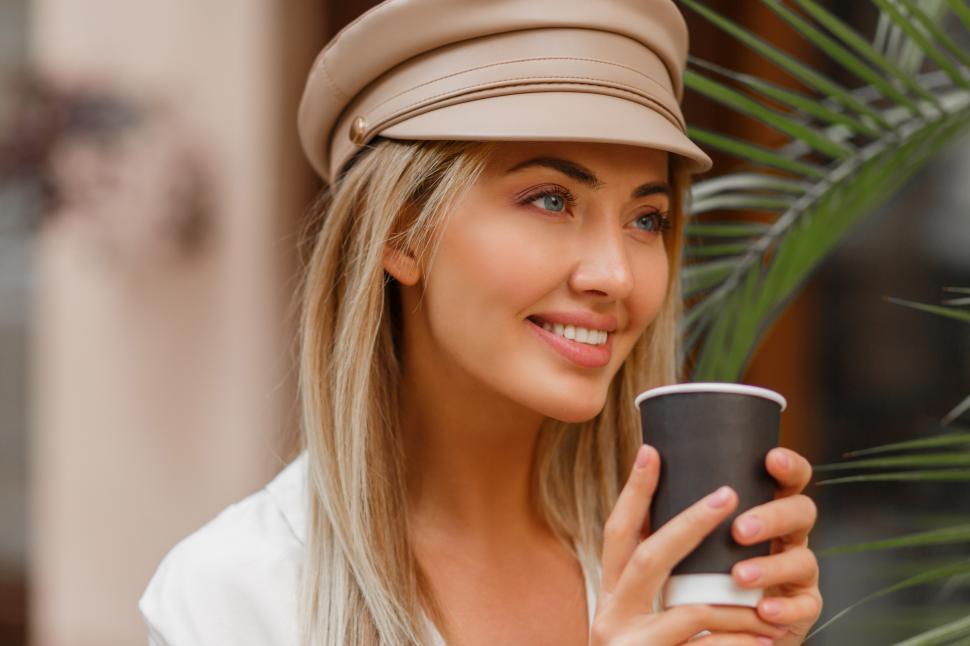 Download Free Stock Photo of Woman enjoying hot coffee outdoors 