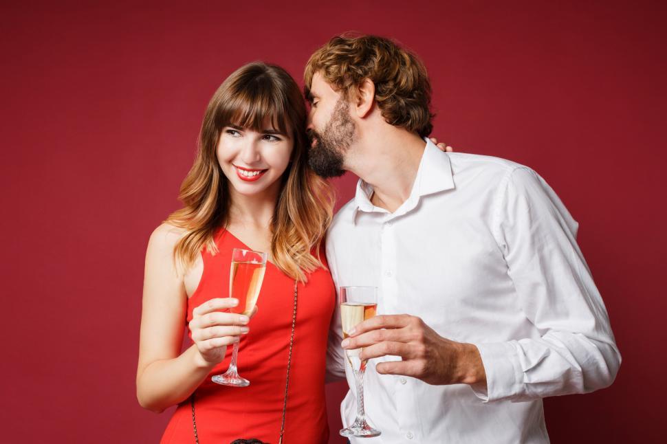 Free Image of Couple in love posing on red background 