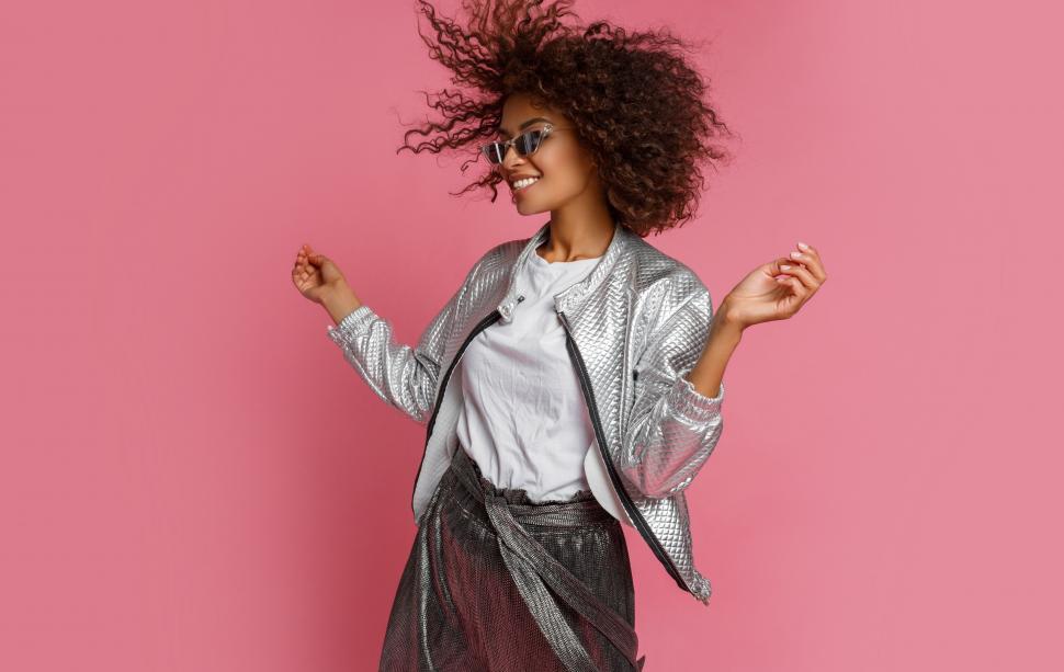 Free Image of Stylish black woman in silver jacket 