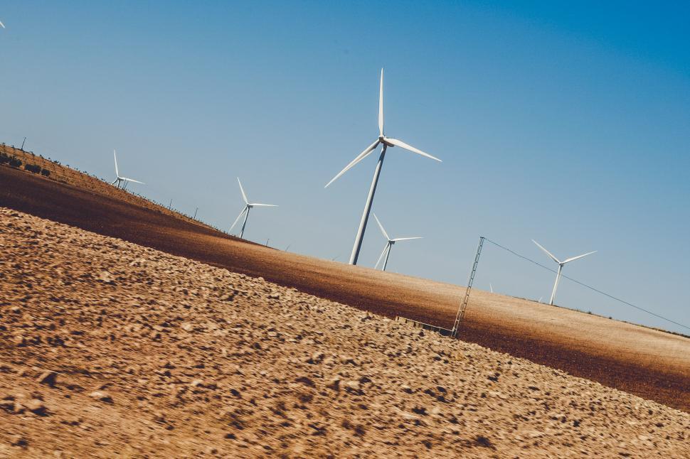 Free Image of view of wind turbines and dry agriculture field 