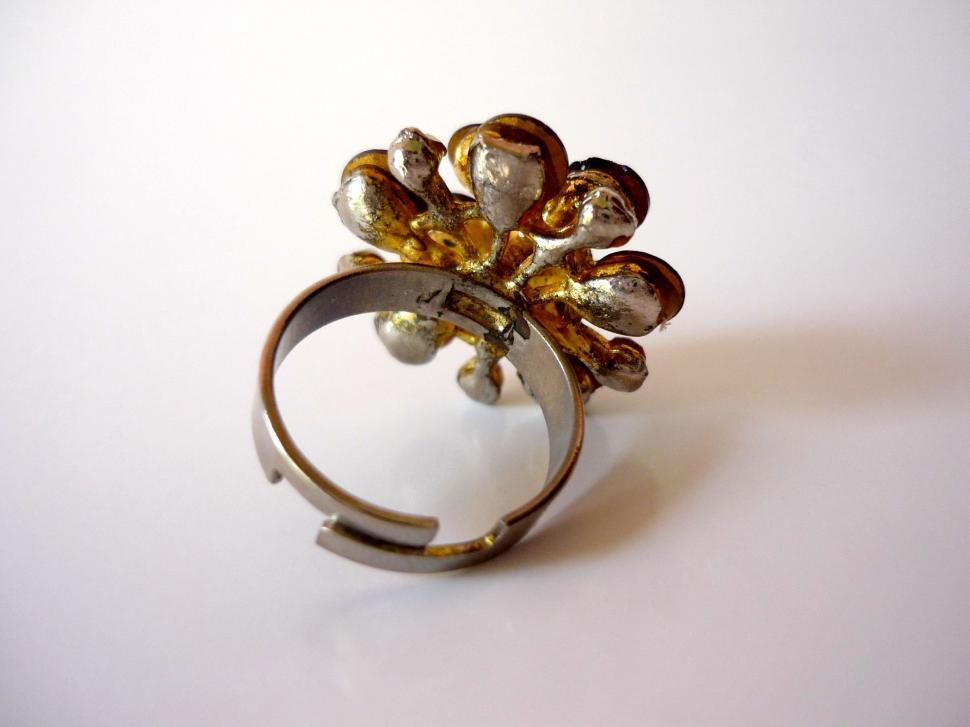 Free Image of Gold and Silver Ring on White Surface 