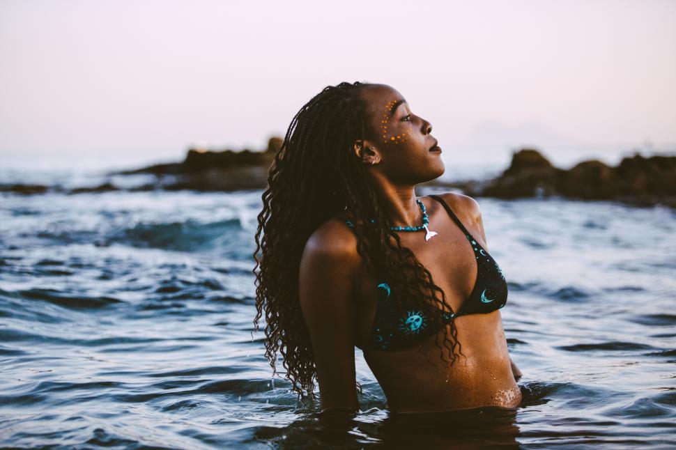 Free Image of Black woman in a sunset bath 