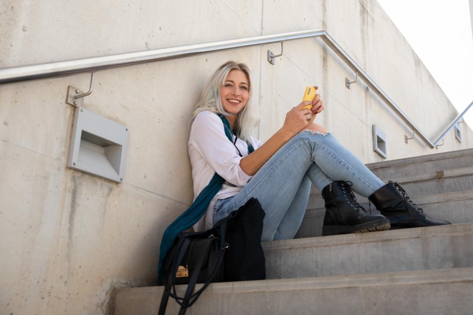 Free Image of blonde woman using a smartphone 