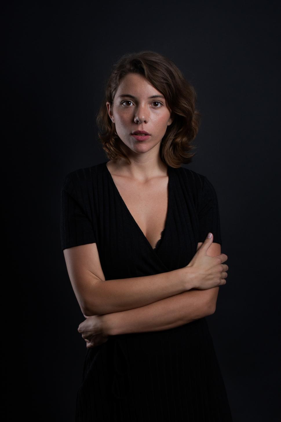 Free Image of A young woman looking at the camera in a studio shot 