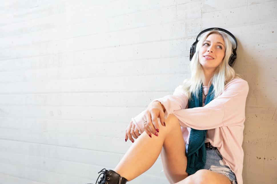 Free Image of A relaxed beautiful young woman listening to music 