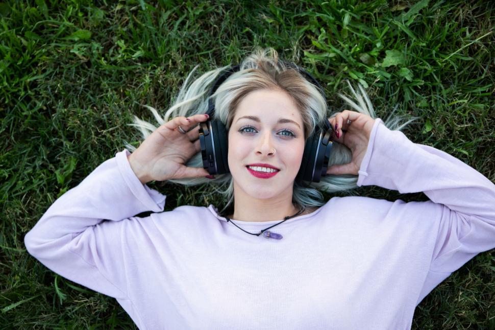 Free Image of woman chilling and enjoying music with headphones 
