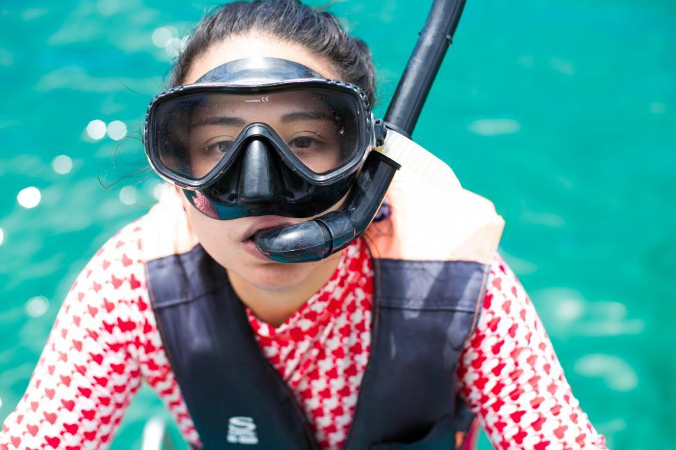 Free Image of Girl having fun in ocean water snorkeling on Caribbean vacation 