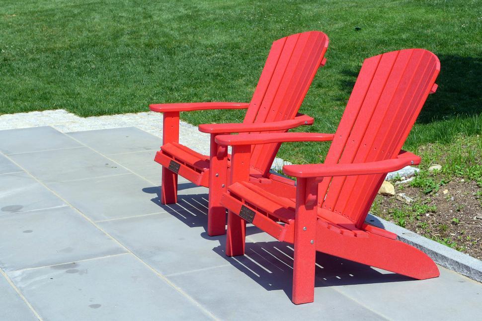 Free Image of Two Red Adirondack Chairs 