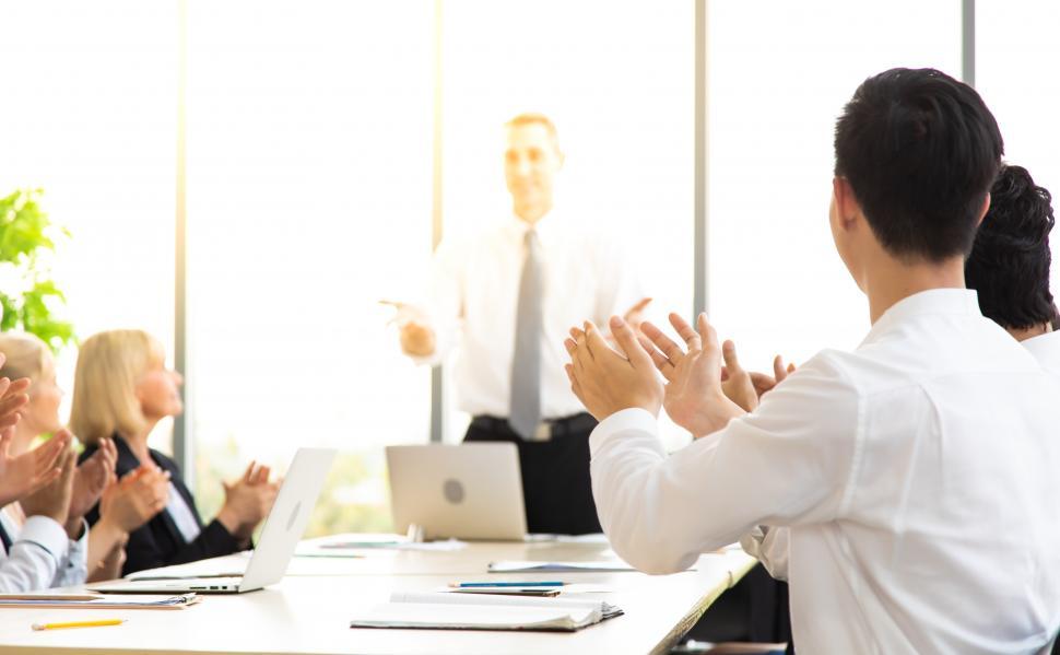 Free Image of Group of business workers applauding presentation 
