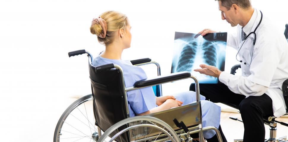 Free Image of Doctor showing x rays to patient 