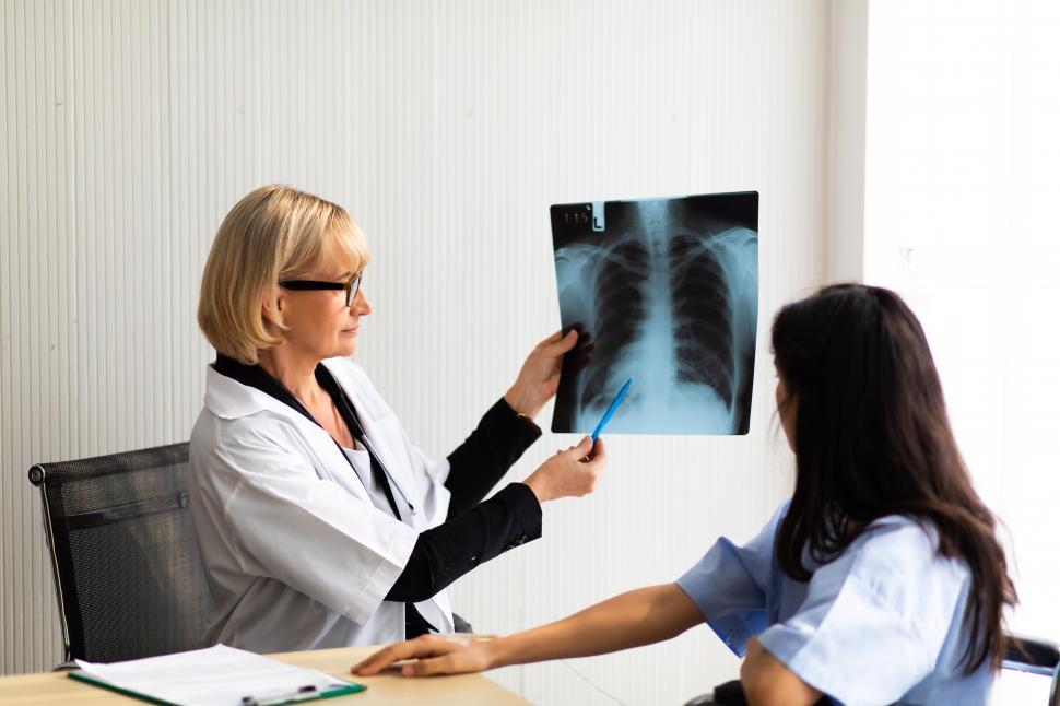 Free Image of Doctor explaining x-ray to a patient 