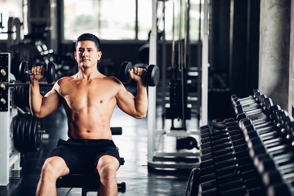 Free Image of Man exercising with free weights 