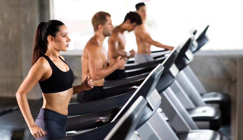 Free Image of attractive young woman running on treadmill 