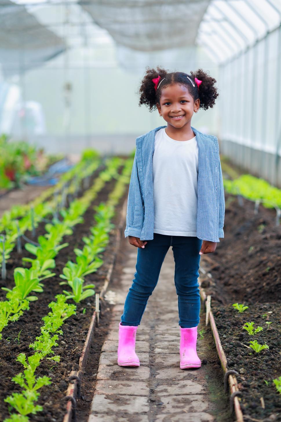 Free Image of portrait of young black girl in greenhouse 