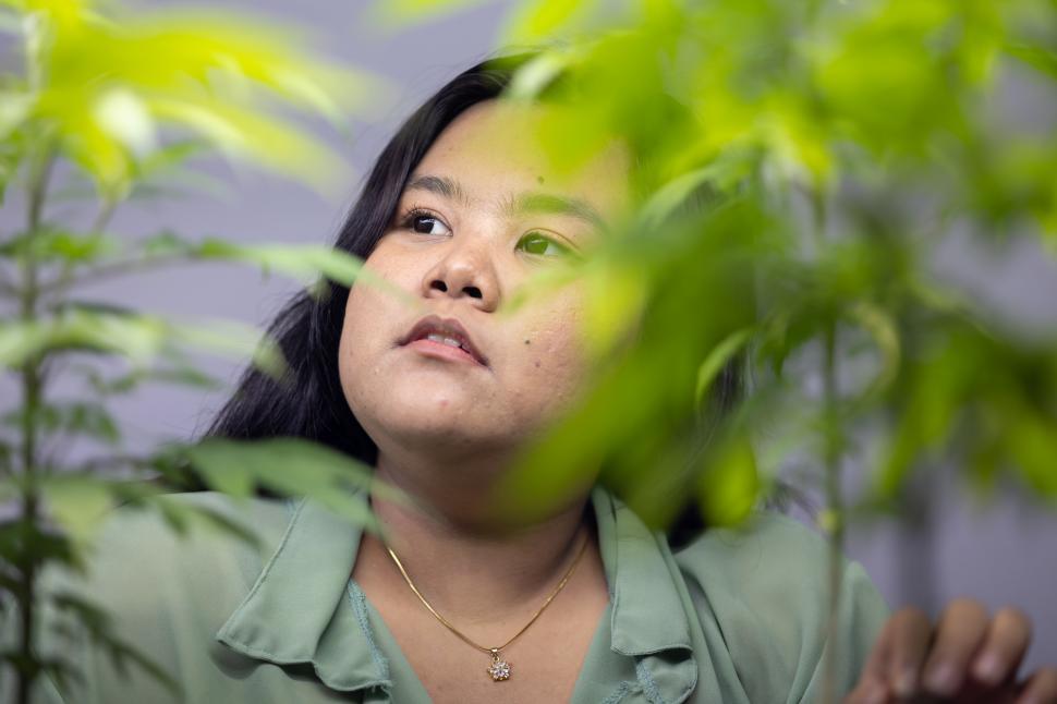 Free Image of Portrait of women in cannabis greenhouse 